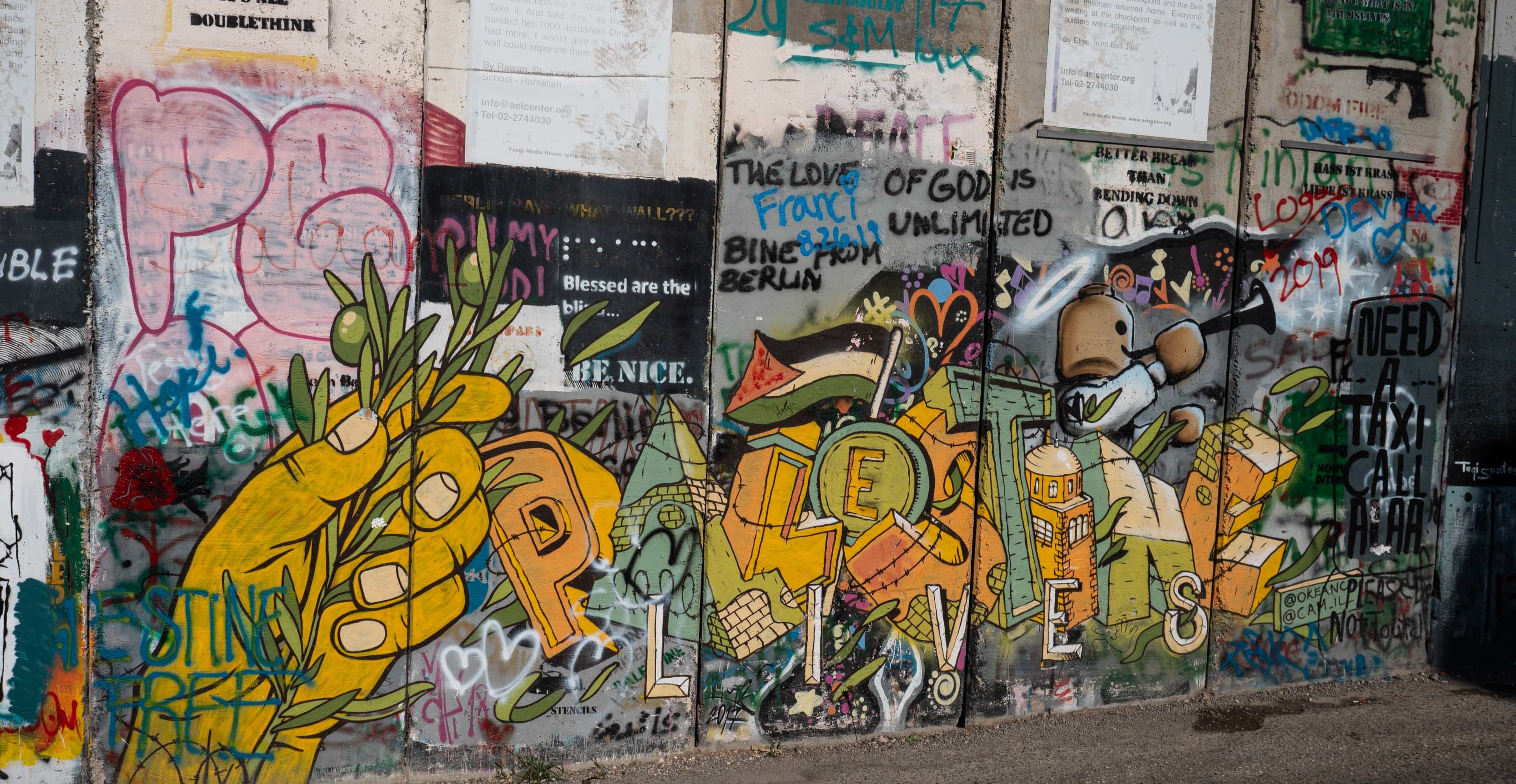 The Israeli West Bank barrier became a symbol for the power of peaceful protest and art as a tool of criticism. Nevertheless, the paintings on the wall are not uncontroversial: some Palestinians want the wall to remain unpainted, because it confronts the Palestinians with the conflict situation, they live in. In their eyes, changing the walls appearance would “normalize” its existence. 